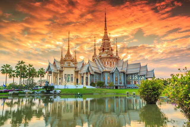 Wat thai, sunset in temple Thailand,They are public domain or treasure of Buddhism @ credit Depositphotos