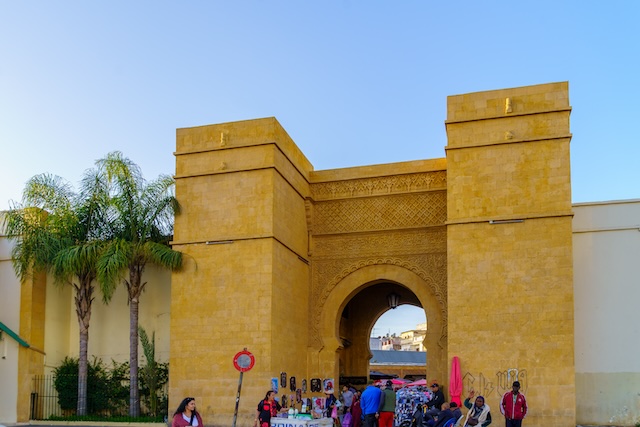 Casablanca, Morocco - March 29, 2023: Street view with Bab lakir gate, locals, and visitors, in Casablanca, Morocco