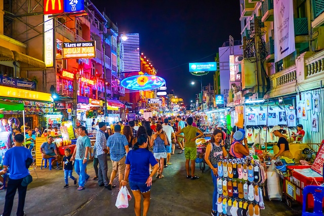 BANGKOK, THAILAND - APRIL 24, 2019: The tourist Khaosan Road is the main all night partying place with numerous bars, shops, hotels and other entertainments for tourists, on April 24 in Bangkok