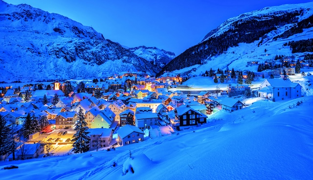 Andermatt village in Alps mountains in winter snow, Uri, Switzerland