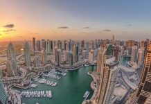 Dubaï | Soumitra Saha nommé ‘Chief Financial Officer’ de TIME Hotels Sunrise over Dubai Marina skyscrapers and jumeirah lake towers panoramic view from the top aerial morning timelapse in the United Arab Emirates. Floating yachts and boats
