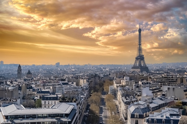 Paris, beautiful Haussmann facades and roofs in a luxury area of the capital, view from the triumph arch, with the Eiffel Tower
