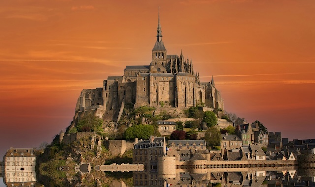 clouds over Mont saint Michel abbey, normandy, france