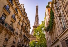 France | Transaxio Hôtel renforce son bureau parisien avec l’arrivée d’Adrien Olivereau Beautiful view to the Eiffel Tower in Paris between the typical mansions@ credit Depositphotos.com