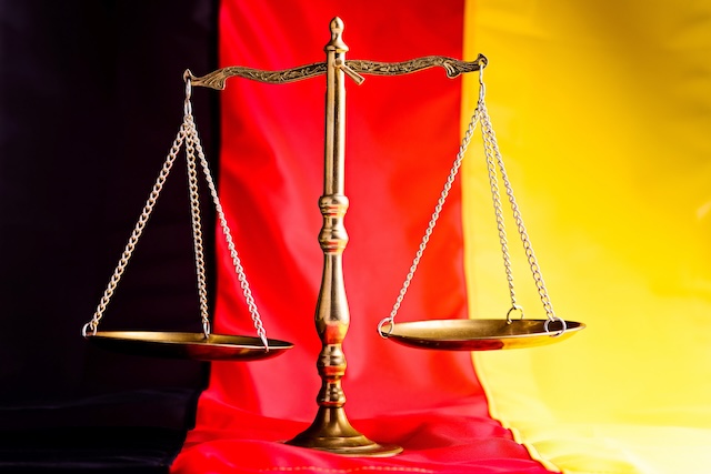 German law. Scales of justice - the symbol of law on flag of Germany