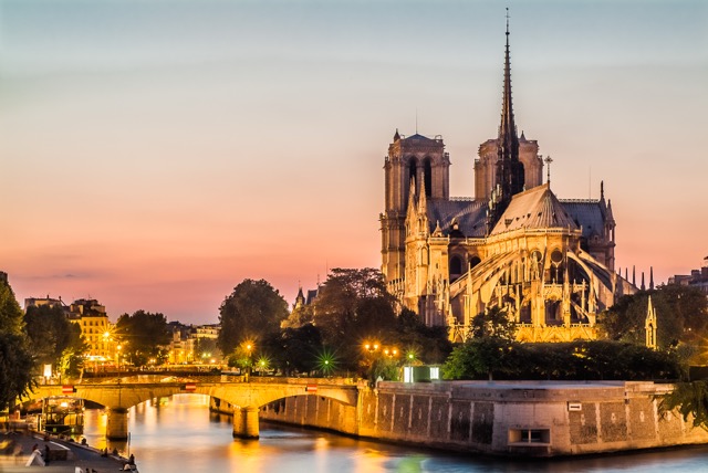 Notre-Dame de Paris by night and the seine river France in the city of Paris in france