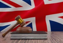 Entente anticoncurrentielle ? | IHG, Marriott, Hilton et STR (CoStar) dans le viseur de l’autorité britannique de la concurrence, le benchmark par un tiers bientôt interdit ? Legal concept with judge mallet and british flag for justice theme.